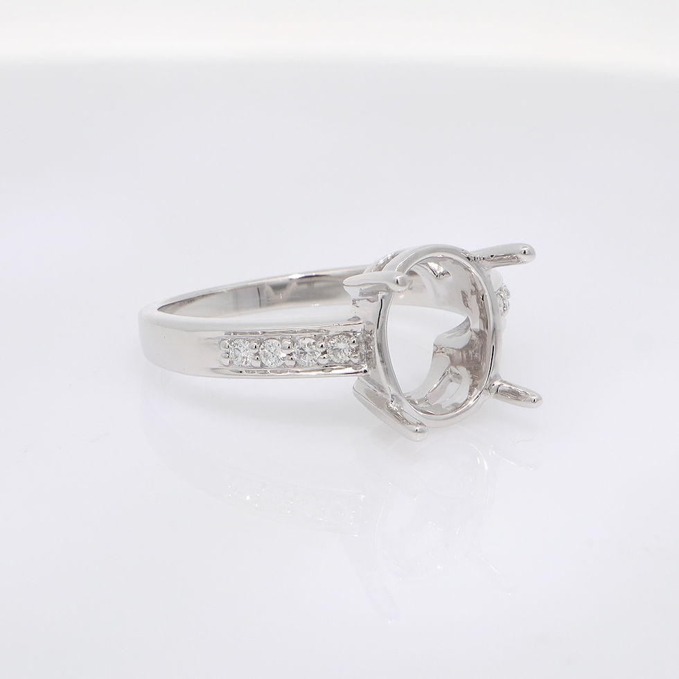 Thumbnail: Classic oval diamond engagement ring setting with a pavé diamond band in fine gold.