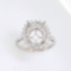 Vintage starburst halo diamond engagement ring setting for an oval stone in fine gold.