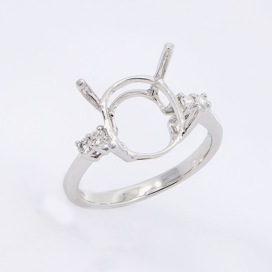 Modern bypass diamond engagement ring setting with trio accents in fine gold.