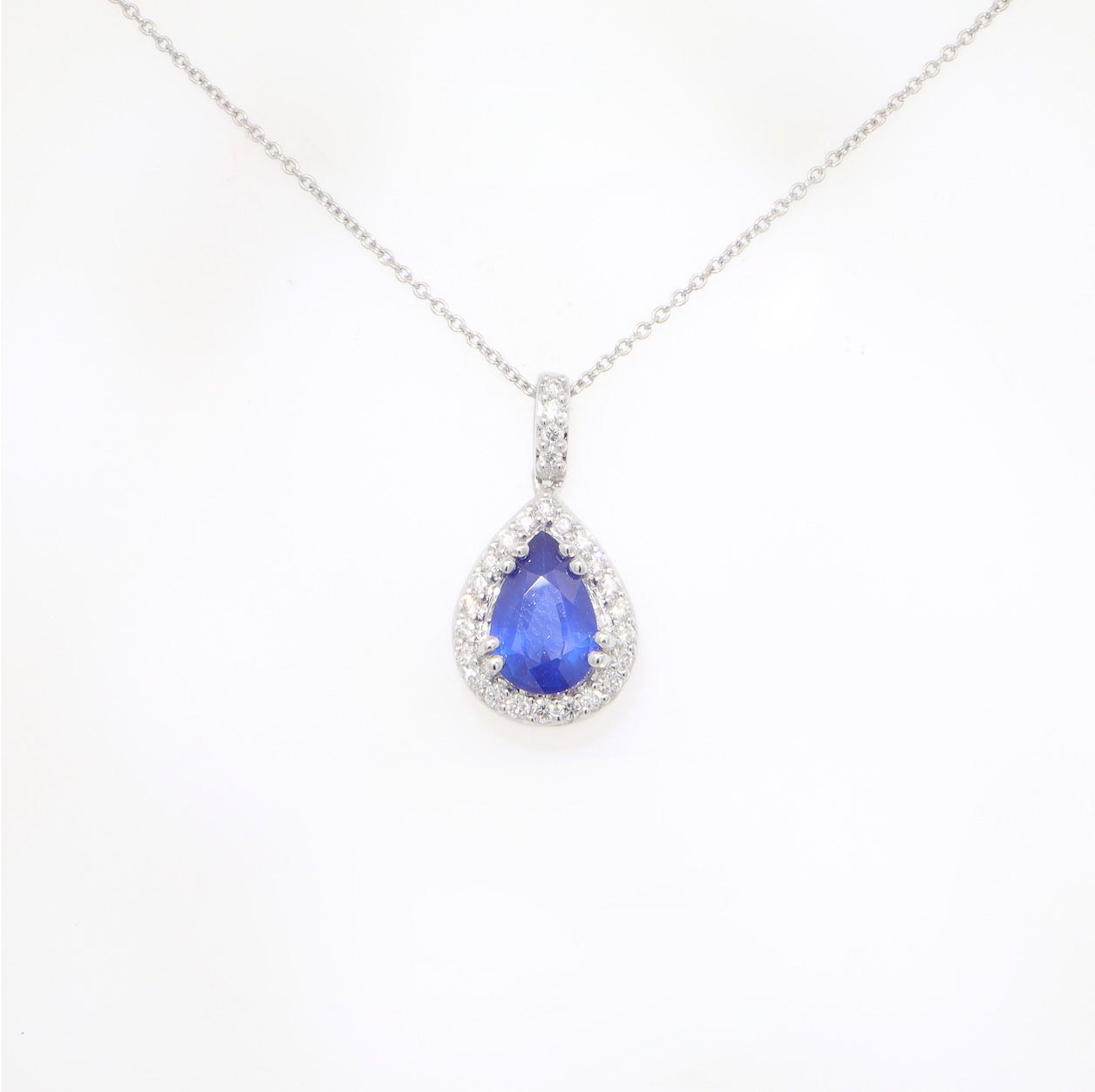 Pear gemstone halo diamond pendant in fine gold on chain