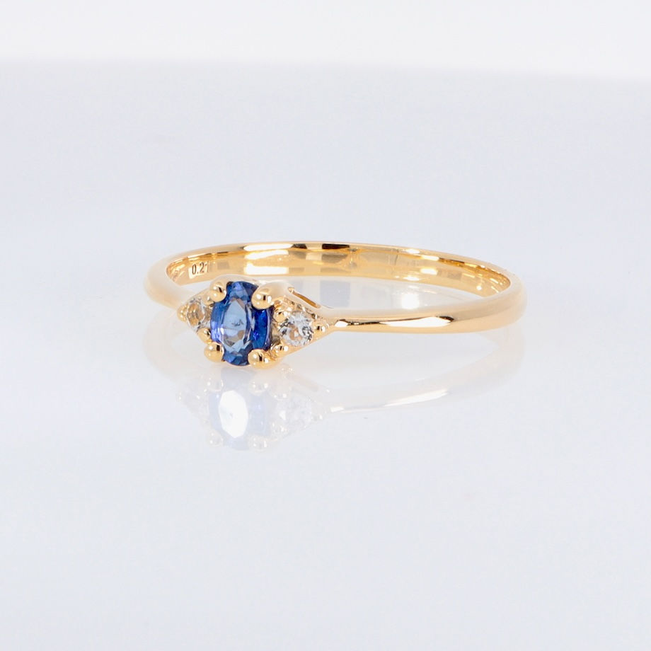 Thumbnail: Dainty oval sapphire ring with diamond leaf accents
