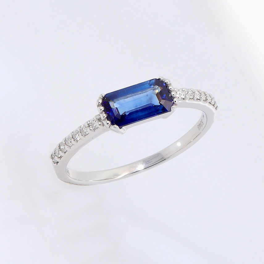 Thumbnail: Minimalist engagement ring setting for an emerald-cut stone with a pavé diamond gold band.