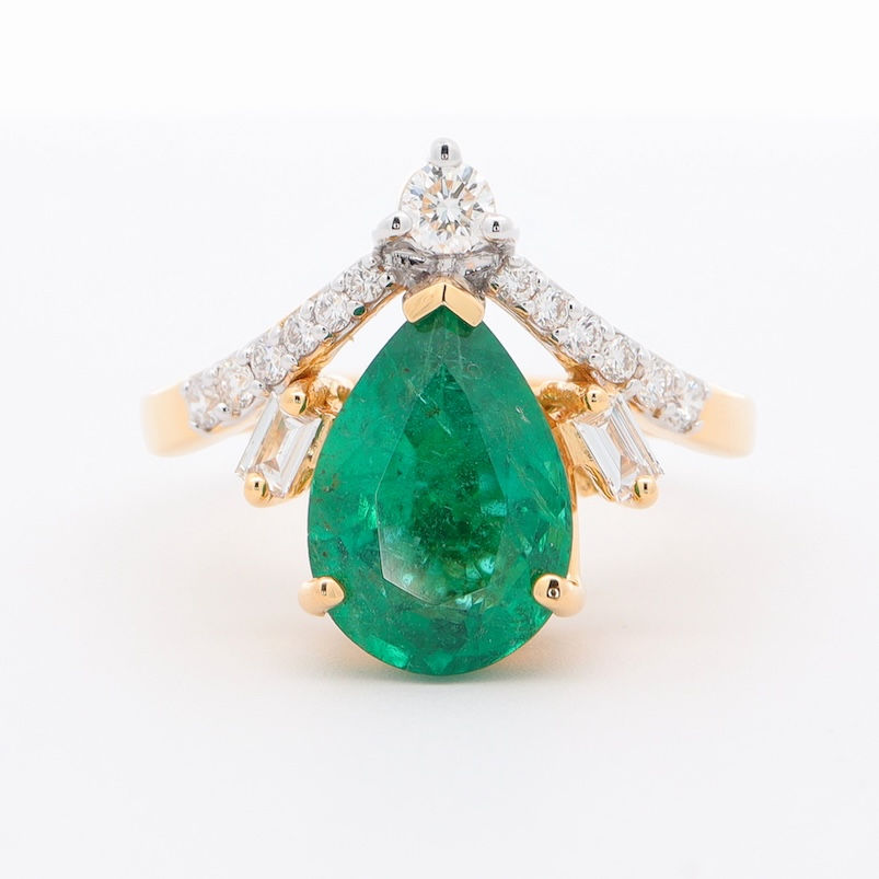 Thumbnail: Pear-shaped engagement ring setting with a chevron band of baguette and pavé diamonds in fine gold.