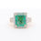 Thumbnail: Bold gemstone cocktail ring with a diamond halo and a wide band of baguette and round diamonds.