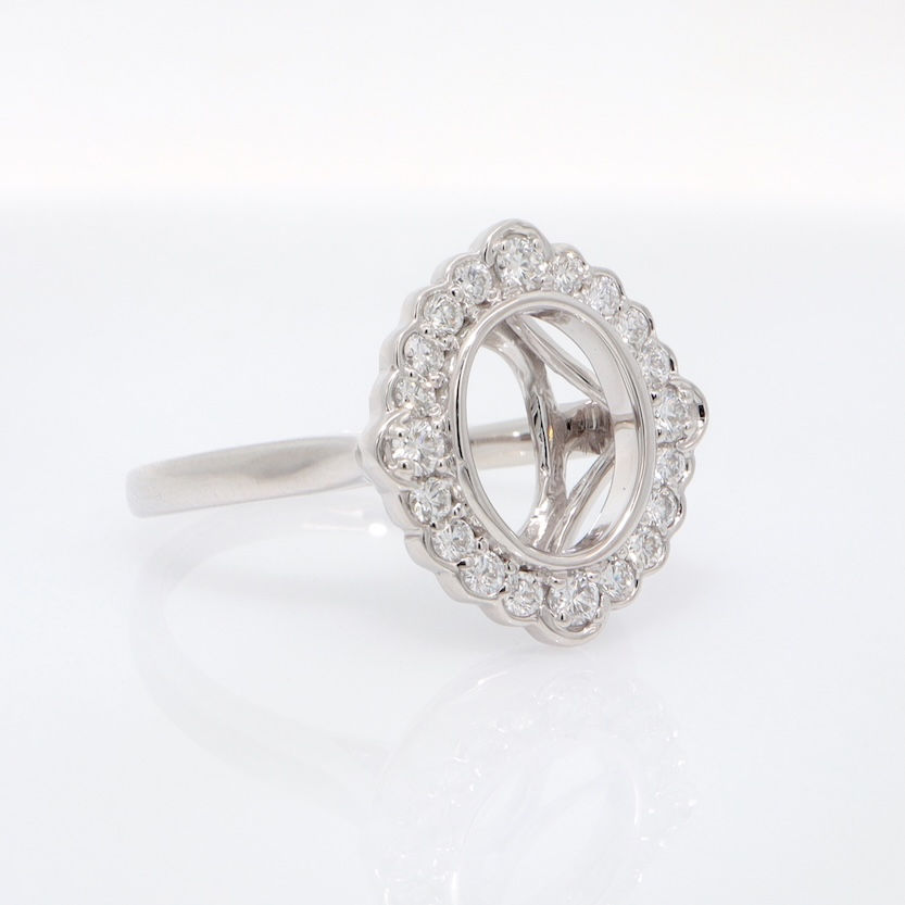 Thumbnail: Vintage scalloped halo diamond engagement ring setting for an oval stone in fine gold.