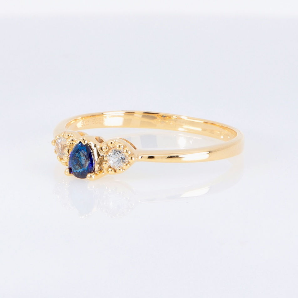 Thumbnail: Elegant pear sapphire trilogy ring with round diamonds