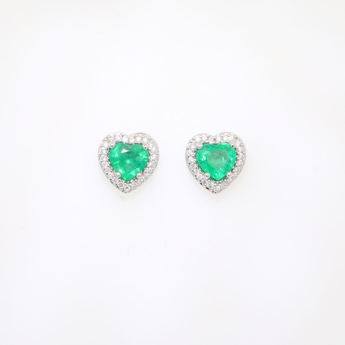 Heart-shaped gold stud earrings with gemstone centers surrounded by sparkling diamond halos