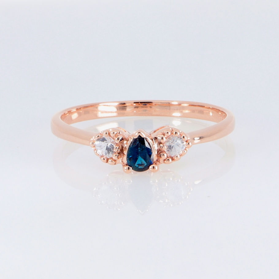 Thumbnail: Elegant pear sapphire trilogy ring with round diamonds