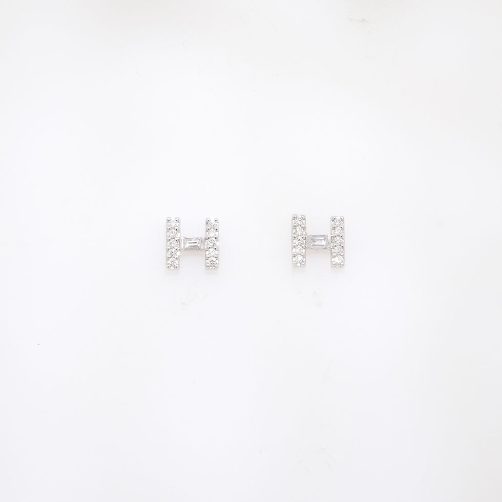 Handcrafted gold diamond H initial stud earrings with brilliant-cut stones and baguette center
