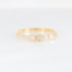 Modern minimalist diamond ring with a geometric baguette diamond cluster in fine gold.