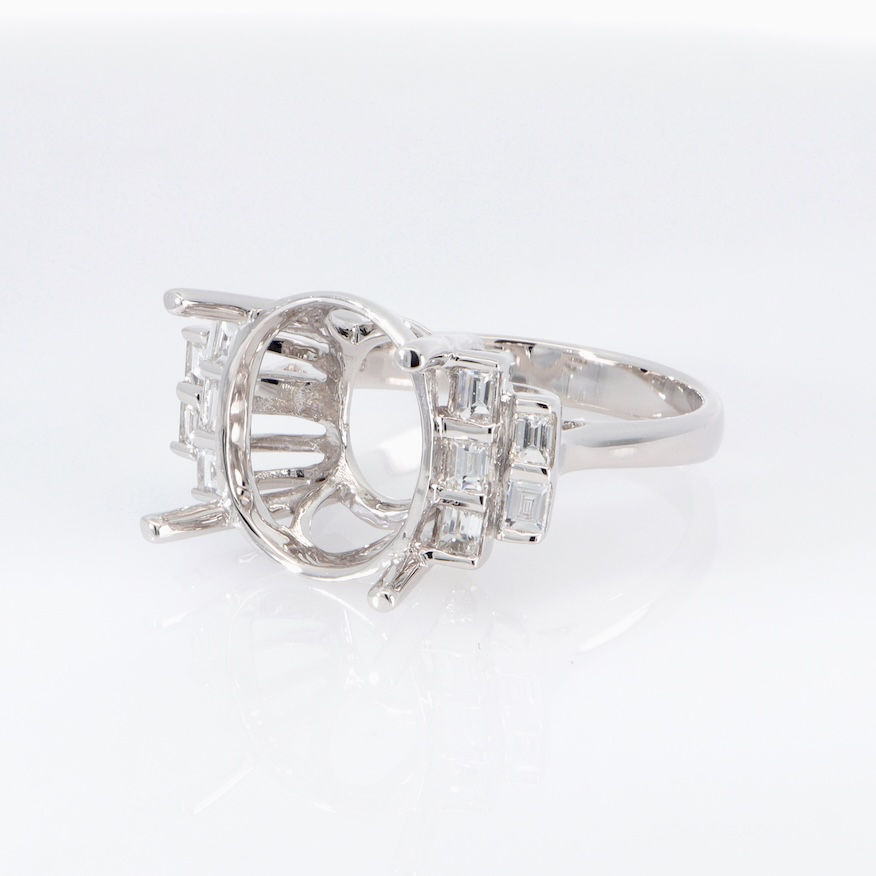 Thumbnail: Modern split shank diamond engagement ring setting with tiered baguette accents in fine gold.