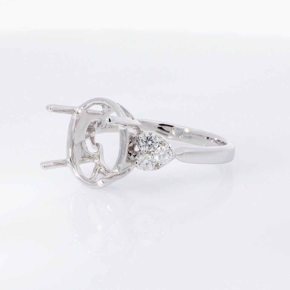 Thumbnail: Elegant oval engagement ring setting with heart-shaped diamond accents in fine gold.