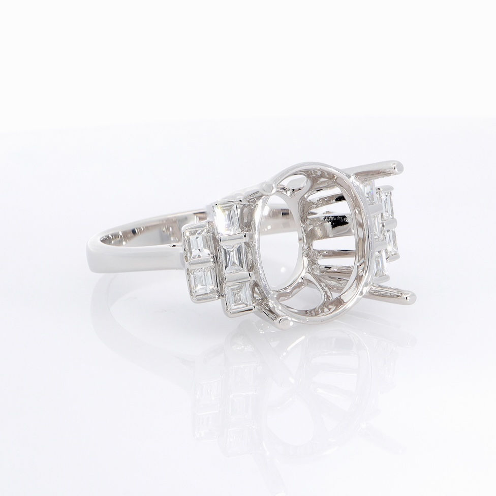 Thumbnail: Modern split shank diamond engagement ring setting with tiered baguette accents in fine gold.