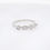 Thumbnail: Geometric diamond ring band with round diamonds set in marquise and square shapes in gold.