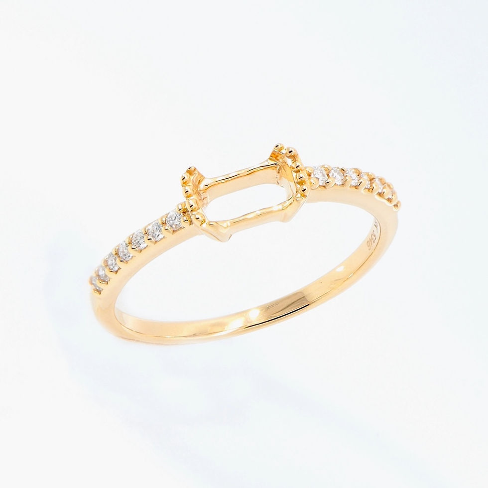 Thumbnail: Minimalist engagement ring setting for an emerald-cut stone with a pavé diamond gold band.