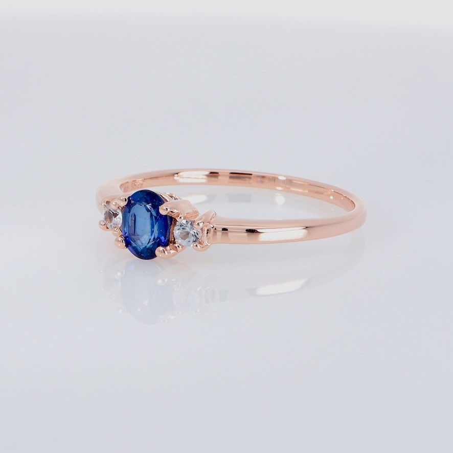 Thumbnail: Oval blue sapphire trilogy ring with diamond accents in gold