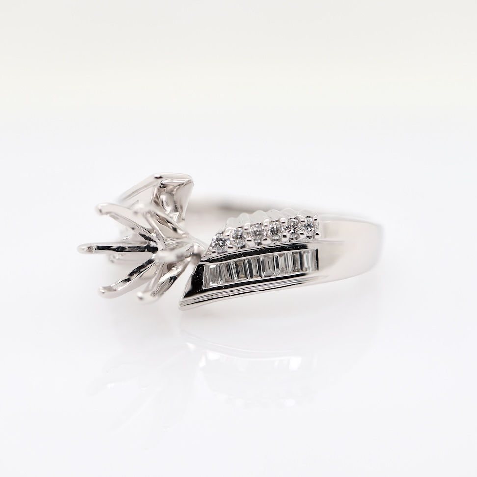 Thumbnail: Luxury diamond solitaire ring with baguette and round diamonds in bypass design