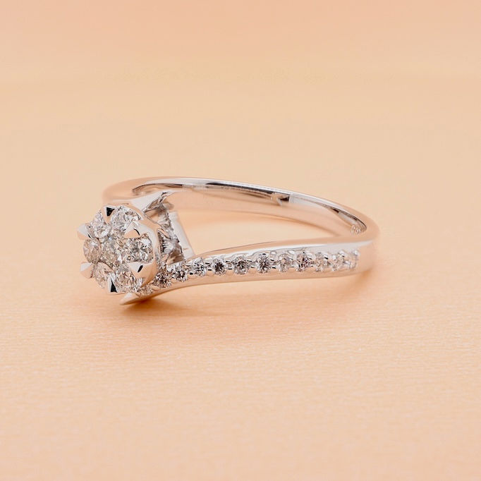 Thumbnail: Luxury asymmetrical solitaire ring with baguette and round diamonds