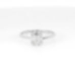 Illusion cluster diamond ring with baguette and round diamonds in a halo design, set in gold.