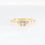 Thumbnail: Modern geometric diamond ring with a plus-shaped baguette diamond cluster in fine gold.