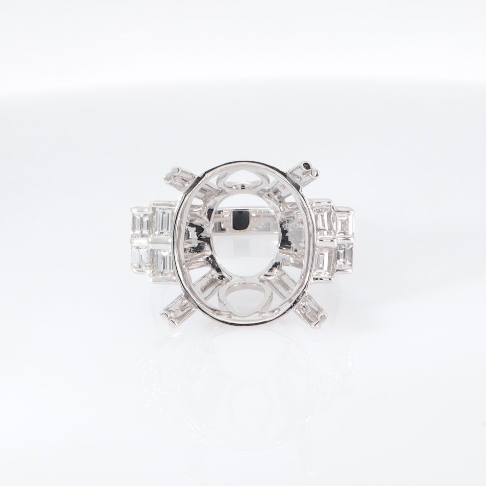 Bold Art Deco diamond engagement ring with multi-row baguette diamonds in fine gold.