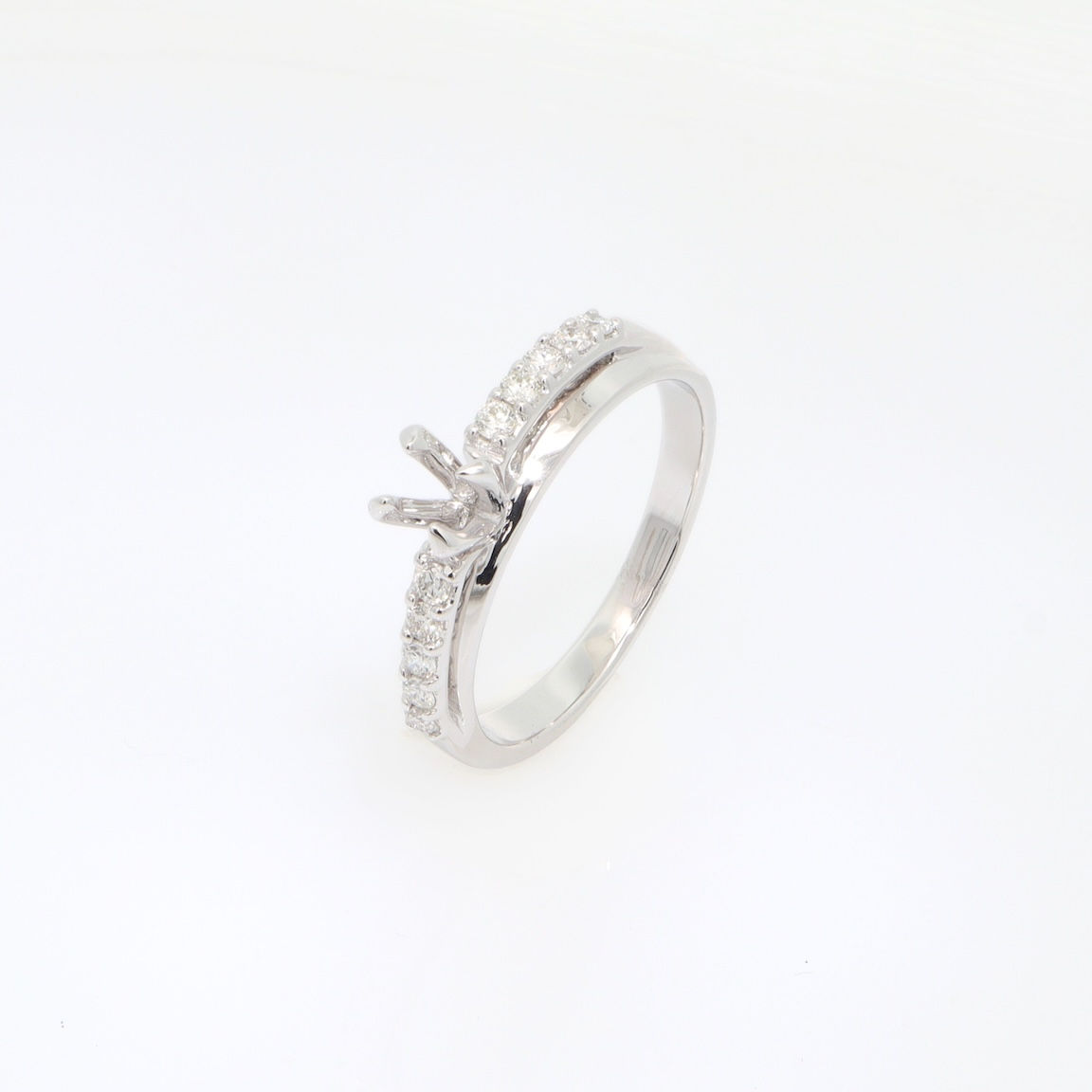 Solitaire semi-mount ring with diamond channel band in fine gold
