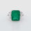 Thumbnail: Bold Art Deco gemstone ring with an emerald-cut gemstone and tiered baguette diamonds.