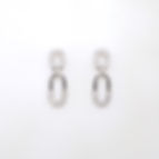 Modern interlocking link diamond earrings with pavé diamond details in fine gold.