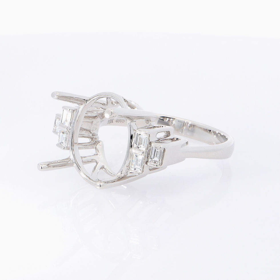 Thumbnail: Oval gemstone ring with baguette diamond shoulders in fine gold