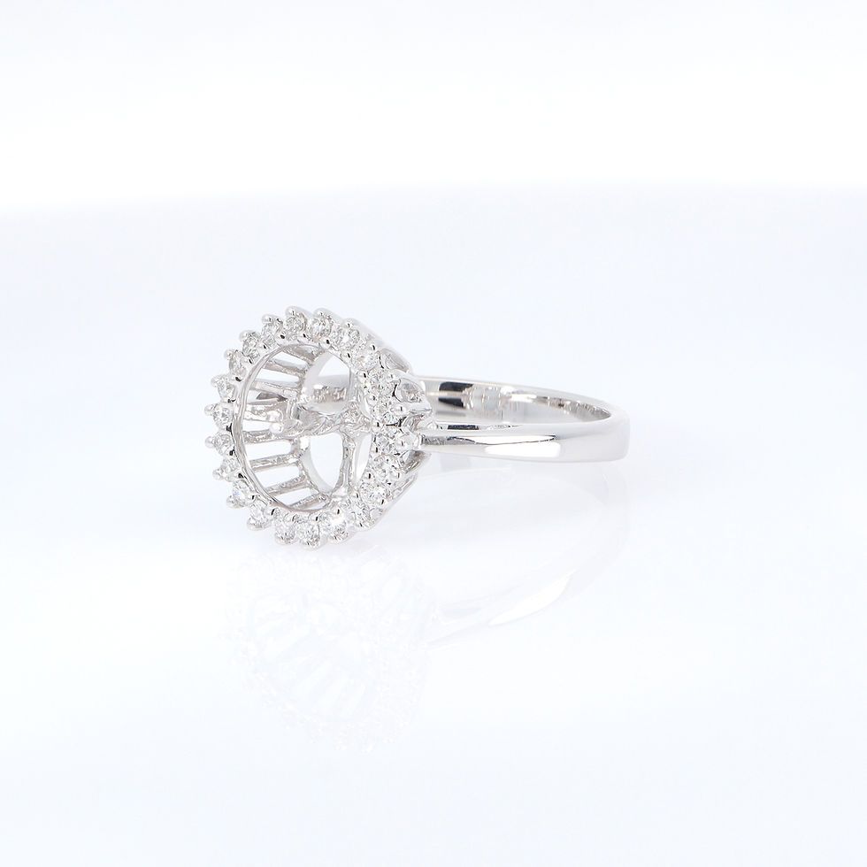 Thumbnail: Classic pearl halo ring mounting with brilliant diamonds in a custom fine gold setting.