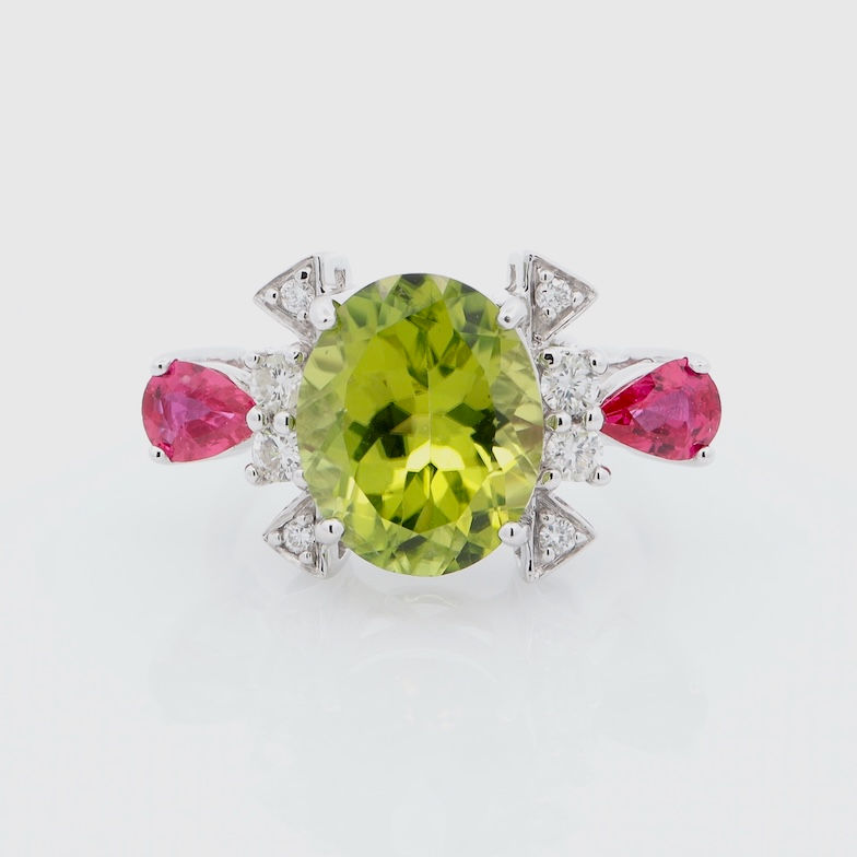 Thumbnail: Bold multi-gemstone ring with oval and pear-shaped gemstones and diamond accents in fine gold.