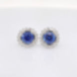 Gemstone halo earrings in gold with brilliant diamonds. Custom fine jewelry wholesale.