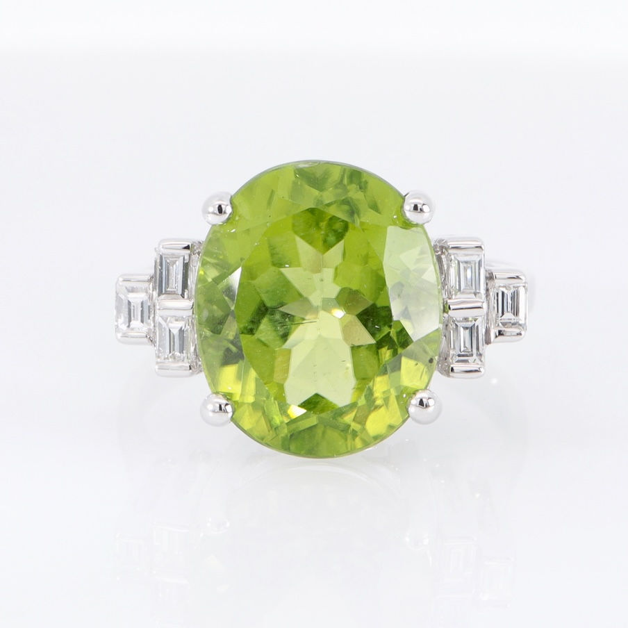 Thumbnail: Oval gemstone ring with baguette diamond shoulders in fine gold
