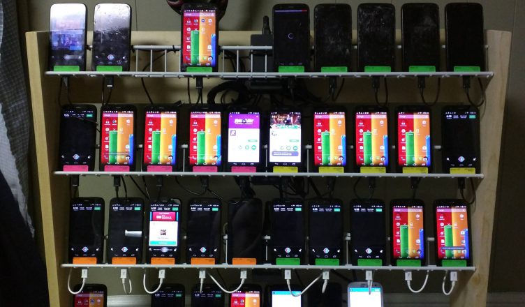 Phone farm used in pig butchering crypto scam operations, explained by Florida cryptocurrency fraud attorney serving Orlando and Central Florida