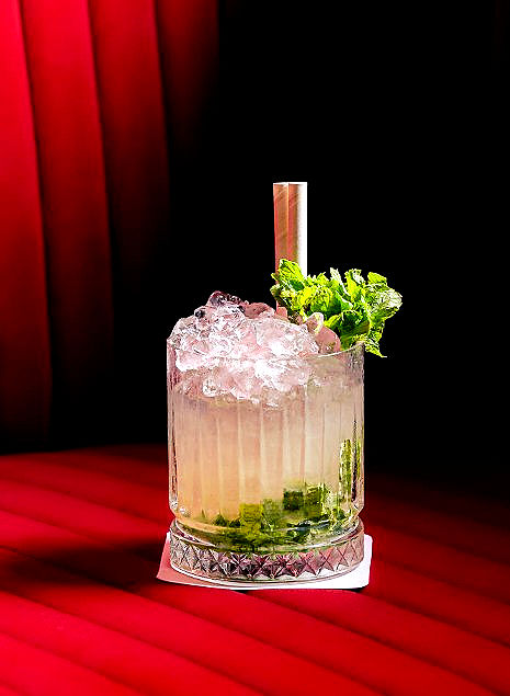 The liquid program leans into savory botanicals, clarified bases, and house-made infusions. Signature creations utilize unusual elements, such as the Tom Yum Cup which shakes premium vodka with a fiery mix of galangal, kaffir lime, and house-brewed chili syrup. Classic recipes are given distinct regional twists, resulting in complex, bitter-sweet profiles like the KOKO Negroni, the earthy Funky Buddha, and the spiced Muztagh Pass. Other prominent recipes like the smoky Miso Caliente play with umami tones, blending Japanese seasonings with spirits to create deep, lingering notes. The bars themselves function as the active stages of the venue, where bartenders use dry ice, tea smoke, and citrus oils to craft drinks that double as sensory performances.