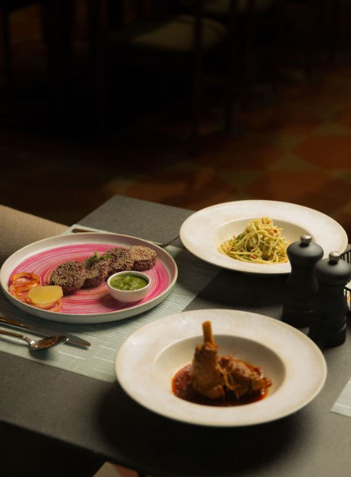 The menu is divided into clear sections, including small plates, sushi, robata & flame, hot bowls, mains, and desserts, making it one of the high-end Hyderabad restaurants India. Small plates are designed for sharing, while sushi and robata sections offer premium ingredients. The mains section includes premium items like seabass and king prawns, indicating a focus on seafood as a core offering. Hot bowls introduce comfort-style dishes with broth or rice-based formats, balancing the lighter earlier courses. Desserts remain minimal, with a focus on citrus and light textures instead of heavy sweets. Overall, the menu is designed for progression, encouraging multiple courses rather than single-dish dining.