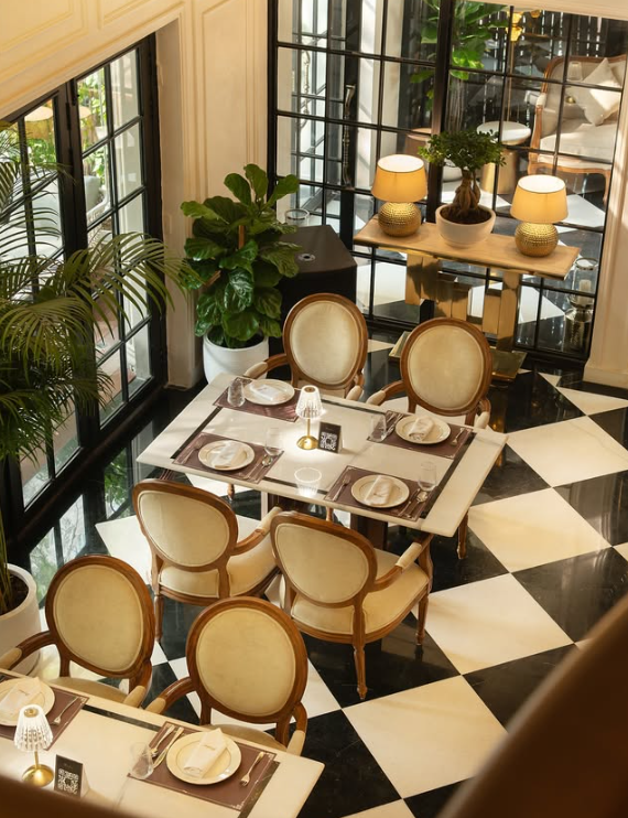 Riches’ is an opulent, European-inspired fine-dining establishment nestled in the quiet enclave of Masjid Moth in Greater Kailash 3. Spearheaded by restaurateurs Mayur Singh Rathore and Sheena Singhania, the destination introduces an elevated concept of "quiet luxury" to South Delhi’s culinary landscape. Spanning a multi-tiered layout, it ranks among the most sophisticated restaurants in GK3, merging classical continental dining traditions with a lively, high-fashion atmosphere. Moving away from typical neighborhood bistros, it seamlessly fuses small-plate gastronomy and avant-garde mixology with an exclusive, secluded outdoor courtyard.