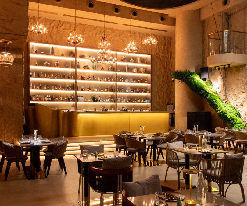 Cavore is a seafood-forward, grill-focused restaurant located in Shanthala Nagar, Bengaluru, known for combining small plates, kebab-style preparations, and a strong cocktail program within a single evolving space. The menu brings together Indian spice-led cooking with contemporary plating, forming a clear backbone of the offering. The kitchen leans heavily on marinades such as hung curd, mustard oil, and chilli pastes, giving the food a distinct depth and smokiness. Alongside this, the bar plays an equally important role, with cocktails designed to match the intensity and layering of the food. Cavore operates as a full-evening destination, where the experience moves naturally from a composed dining setting into a more energetic, social environment as the night progresses.