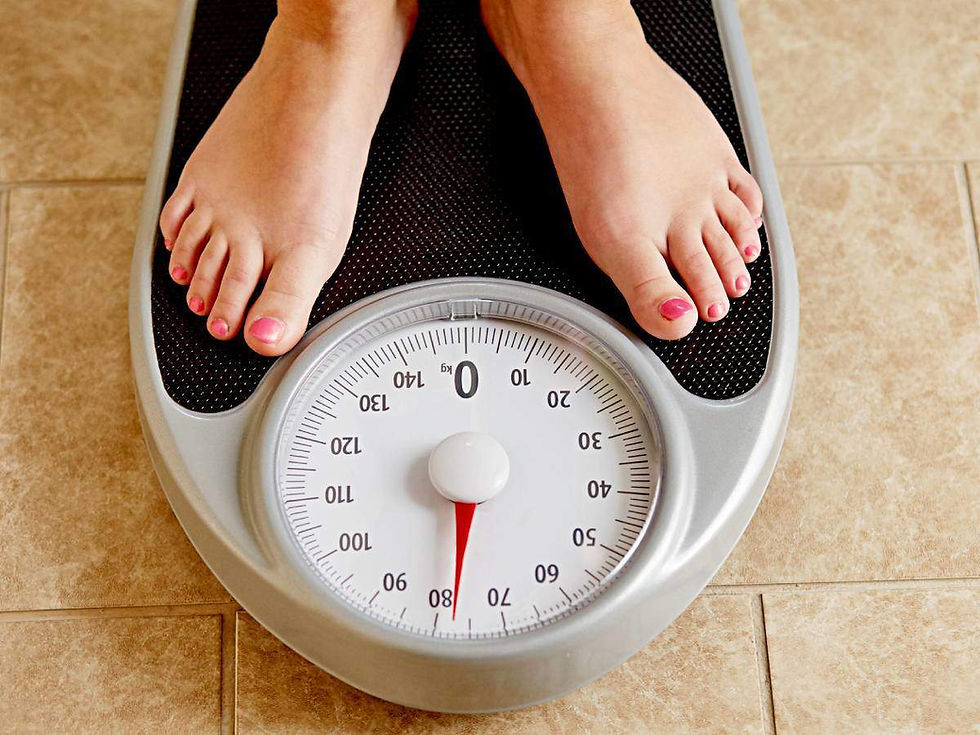 Picture of a person on a scale.