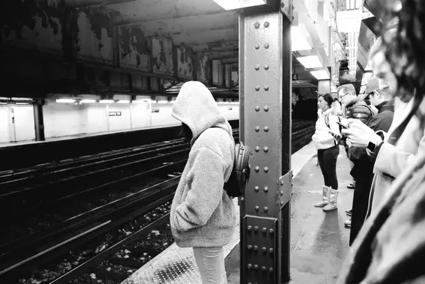 Street Photography by Jason Logan | people waiting for an NYC metro train in the subway.
