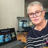 Jill Brown artist in front of computers