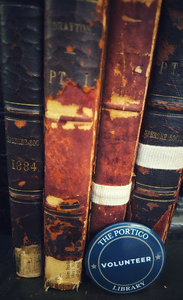 Colour image of old books & volunteer badge