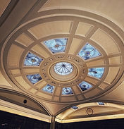 Colour image of round ceiling with stained glass inserts
