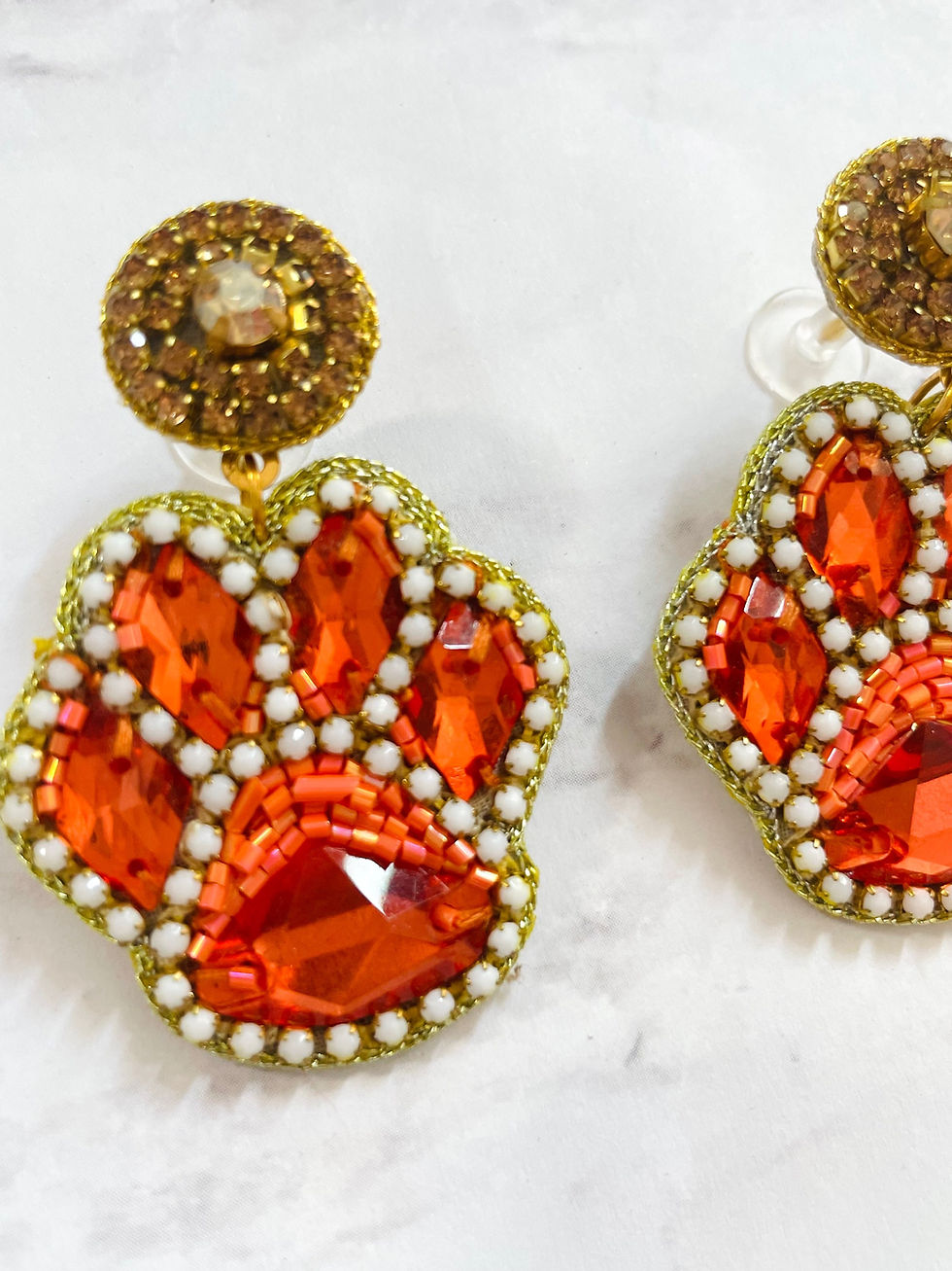 Thumbnail: Trendy Orange + White Beaded Paw Print Gameday Earrings