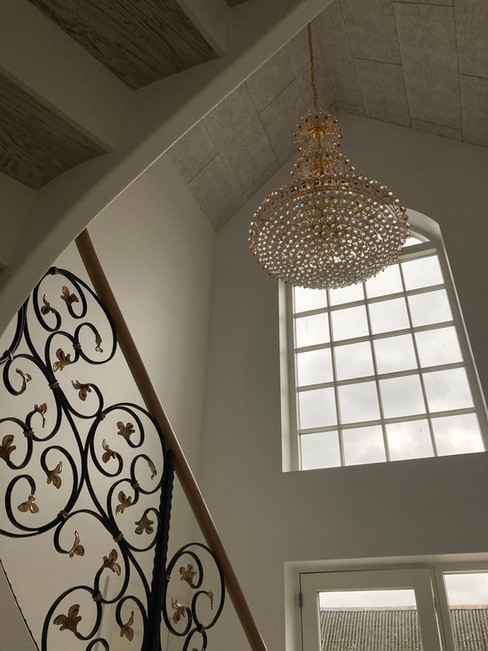 Stairs with custom blacksmith railings.