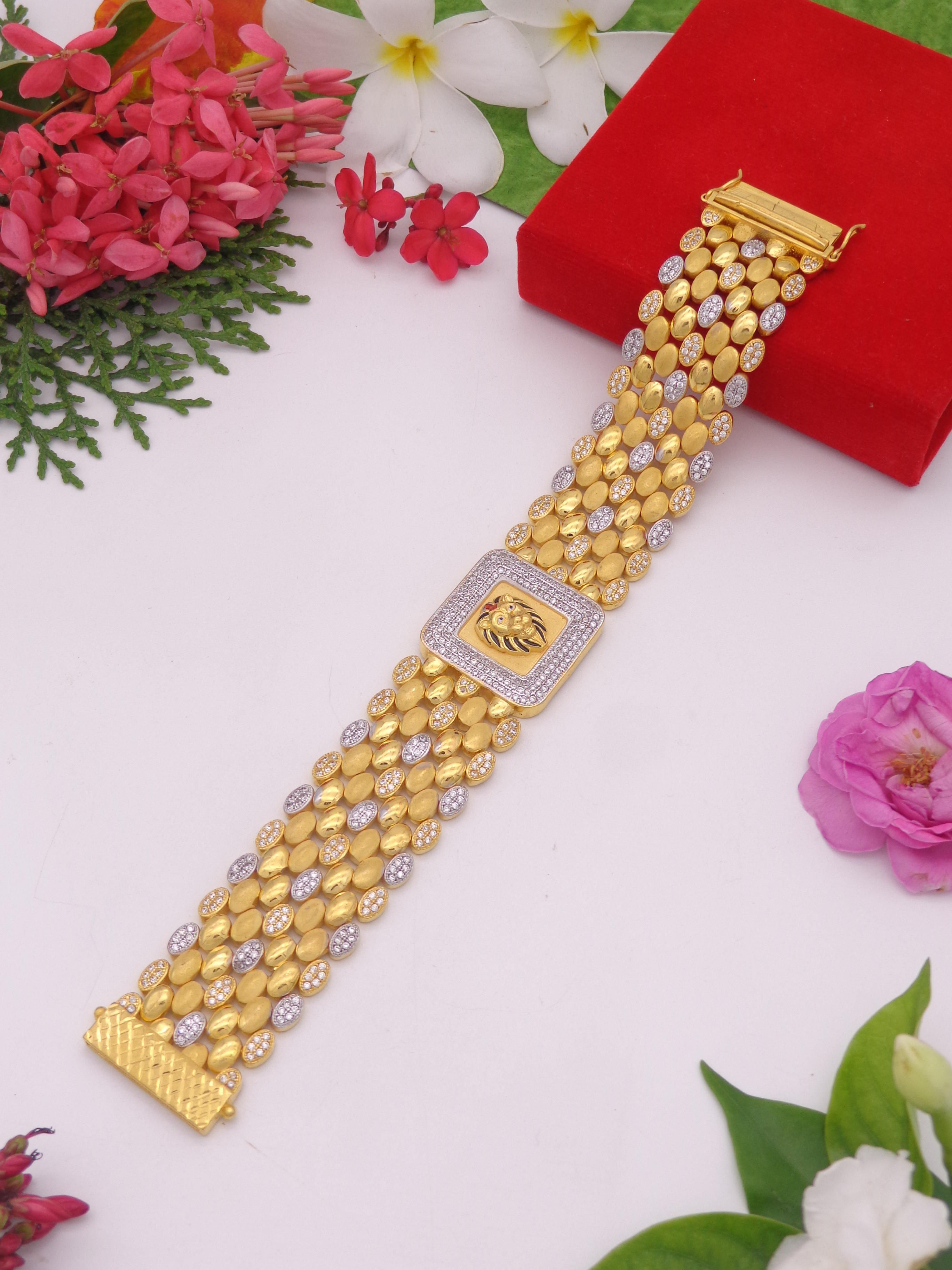 Gold bracelet with lion design