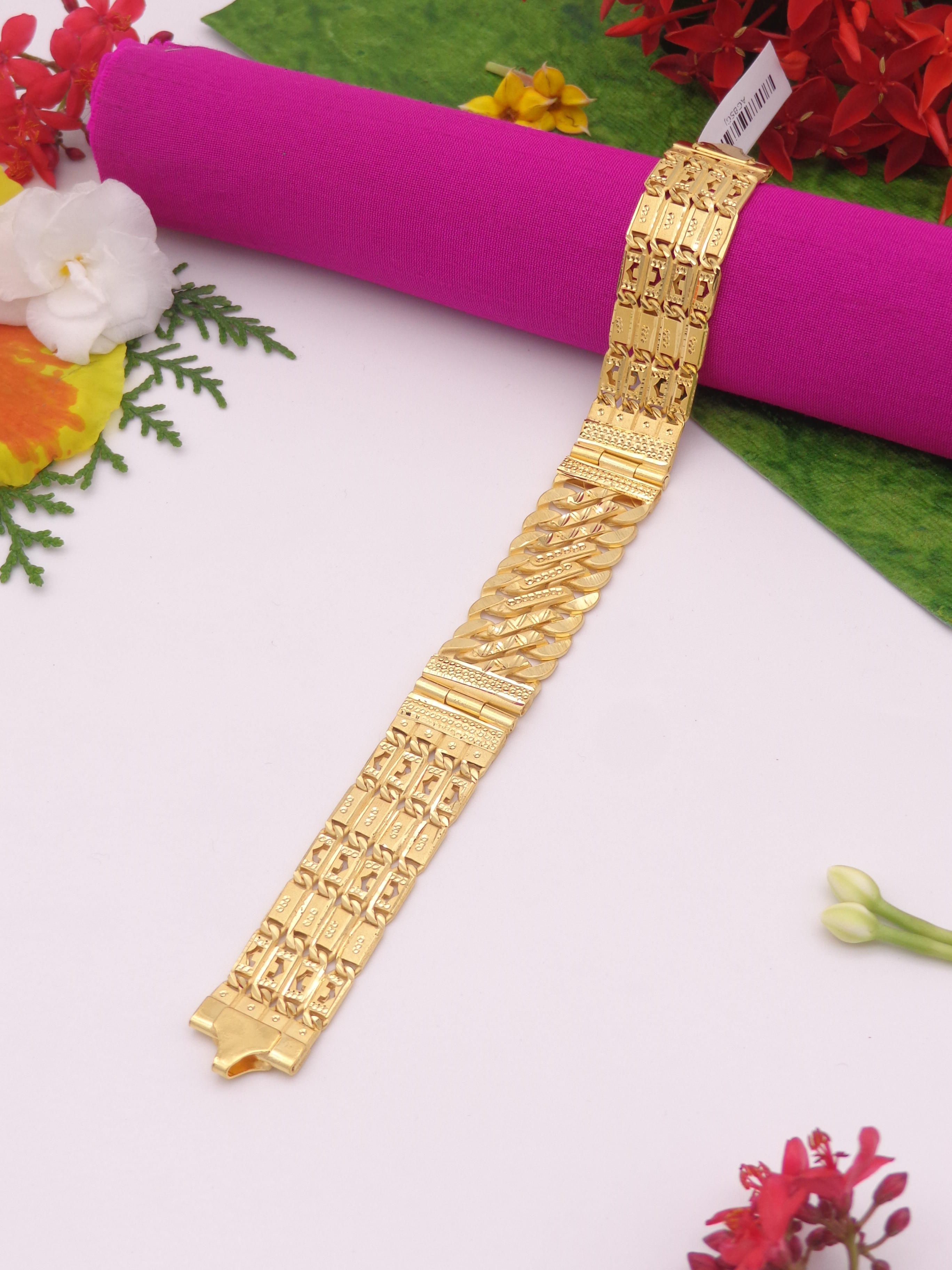 Gold bracelet with intricate design