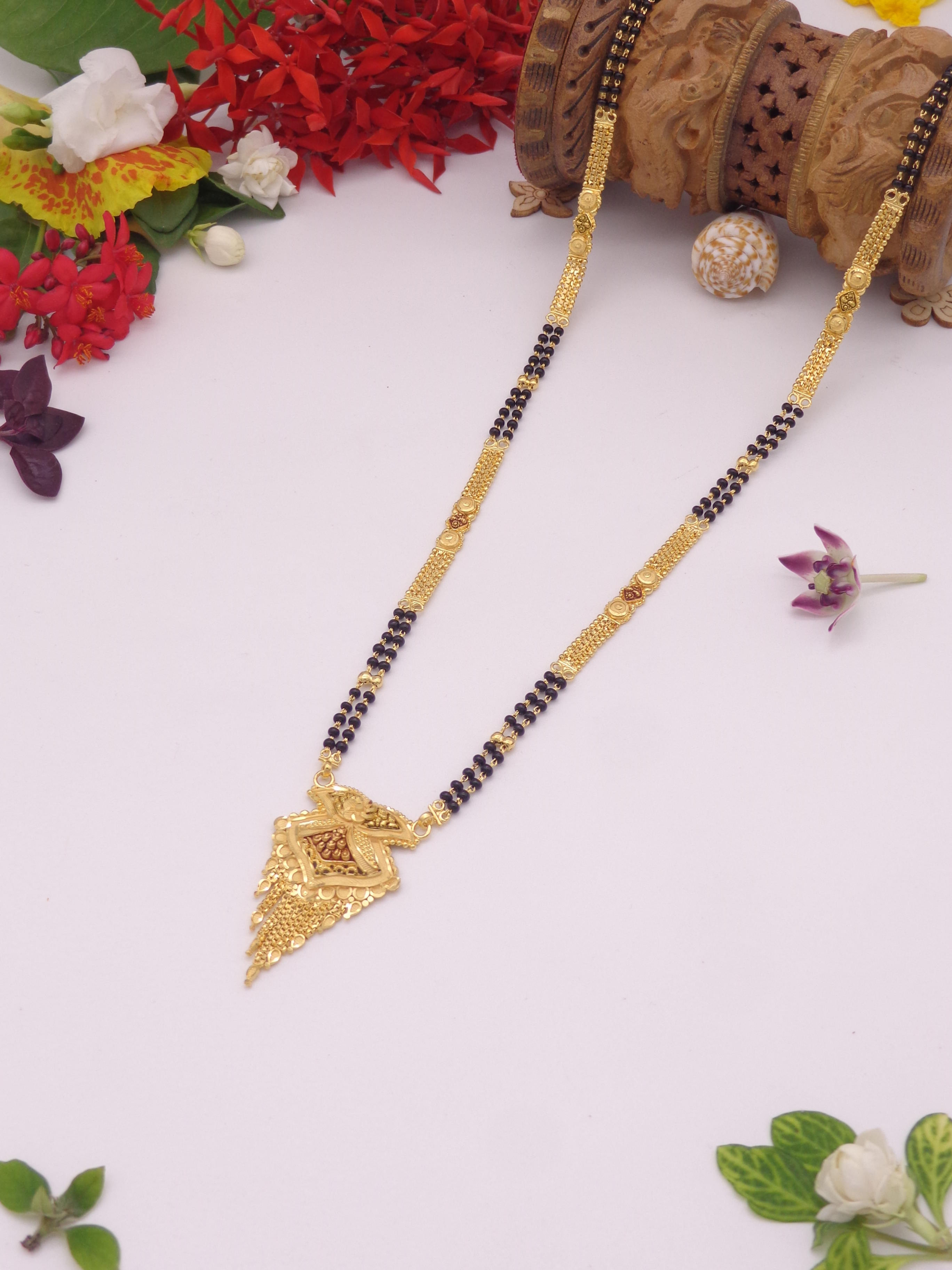 Delicate gold chain with black beads