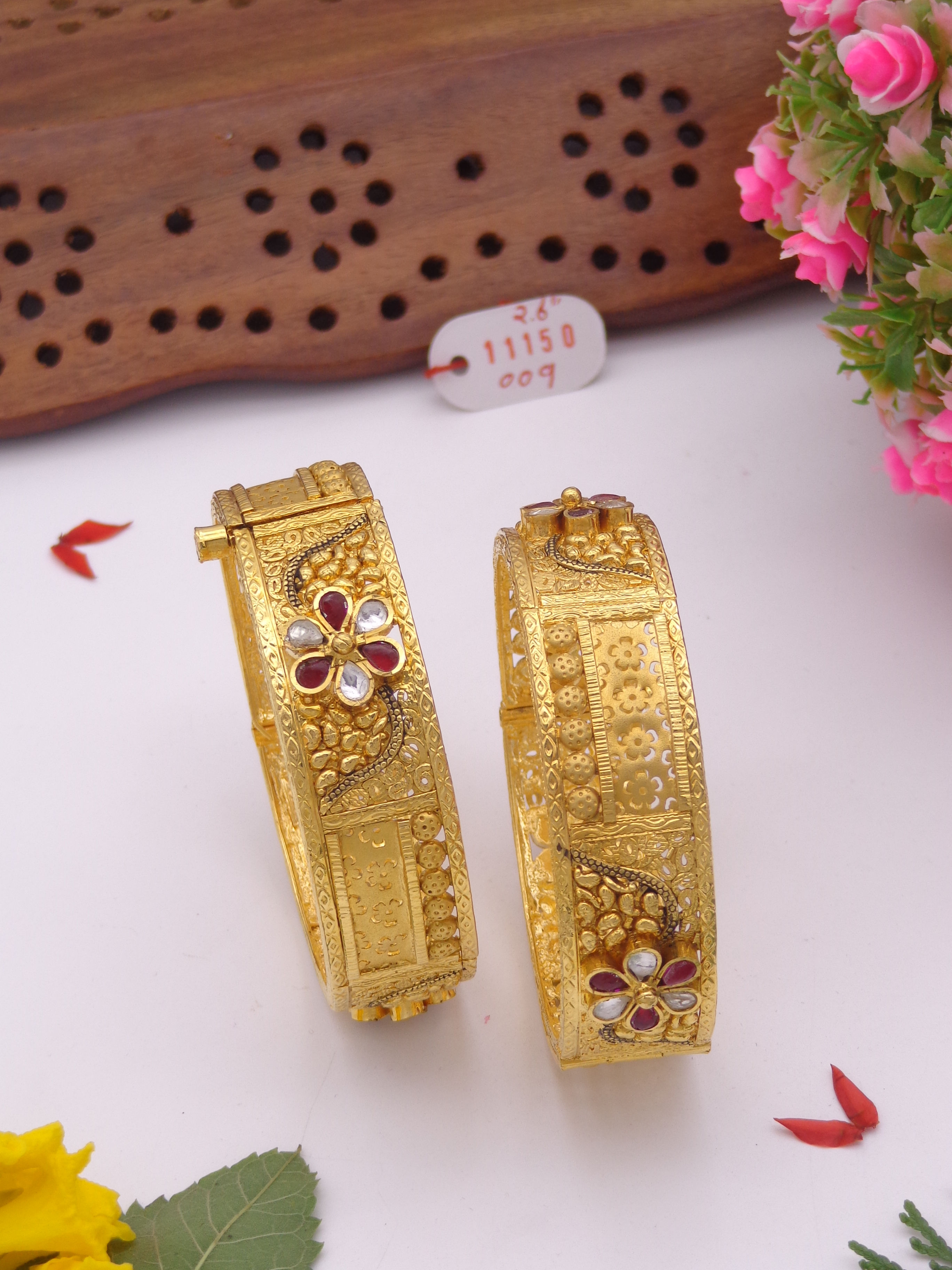 Antique gold bangles with red and white stones