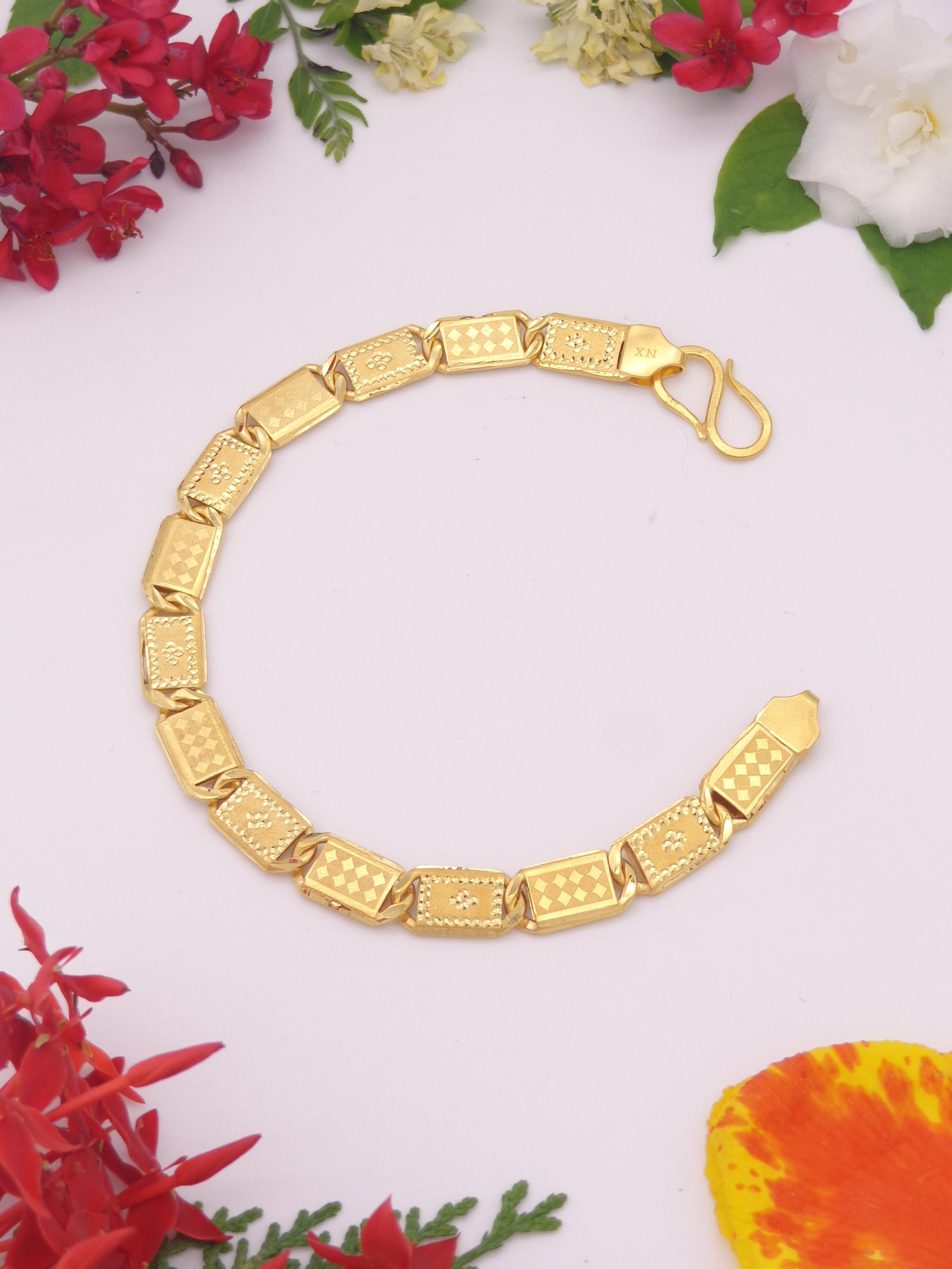 Gold bracelet with intricate design